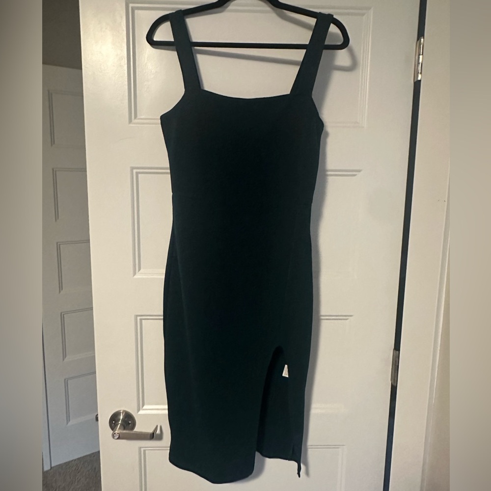 Forest green dress with slit. Size medium.